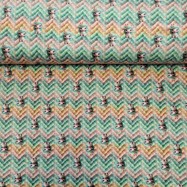 Baumwolljersey mit kleinen Einhörnern auf Strickoptik